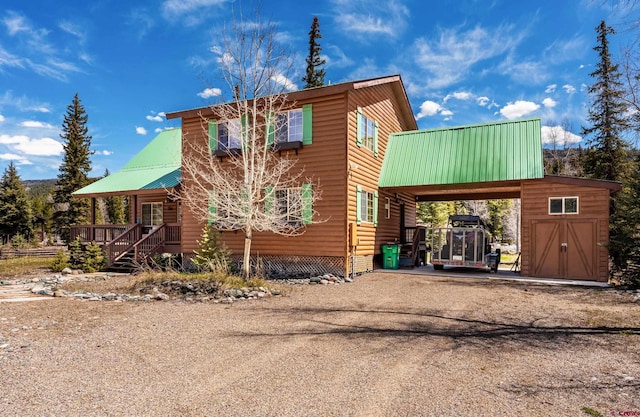 746 W Vallecito Crk, Bayfield, CO 81122 - view of front of home with metal roof and dirt driveway