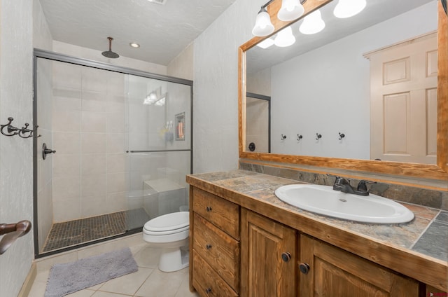 746 W Vallecito Crk, Bayfield, CO 81122 - full bathroom with toilet, tile patterned floors, a shower stall, and vanity