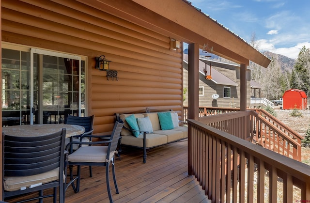746 W Vallecito Crk, Bayfield, CO 81122 - deck featuring an outdoor living space, outdoor dining area, and a mountain view