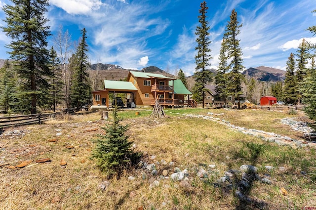 746 W Vallecito Crk, Bayfield, CO 81122 - exterior space featuring a deck with mountain view and fence