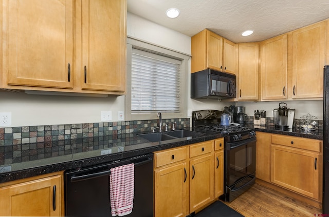 746 W Vallecito Crk, Bayfield, CO 81122 - kitchen with tile countertops, a sink, black appliances, dark wood-style floors, and recessed lighting