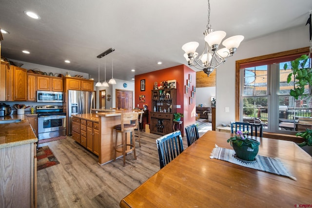500 Dove Ranch Rd, Bayfield, CO 81122 - dining area featuring light wood-style floors, recessed lighting, and a chandelier
