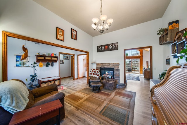 500 Dove Ranch Rd, Bayfield, CO 81122 - living room featuring an inviting chandelier, high vaulted ceiling, wood finished floors, and a fireplace
