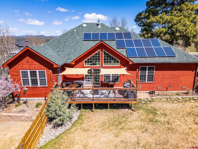 500 Dove Ranch Rd, Bayfield, CO 81122 - rear view of property with a lawn, a wooden deck, roof mounted solar panels, and roof with shingles