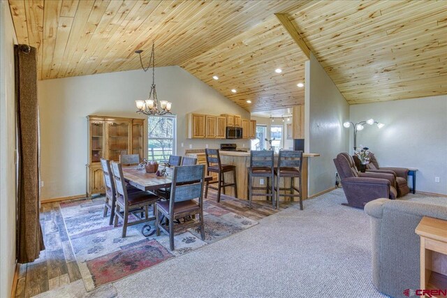 26 Steamboat Dr, Pagosa Springs, CO 81147 - dining room with an inviting chandelier, baseboards, vaulted ceiling, and wooden ceiling