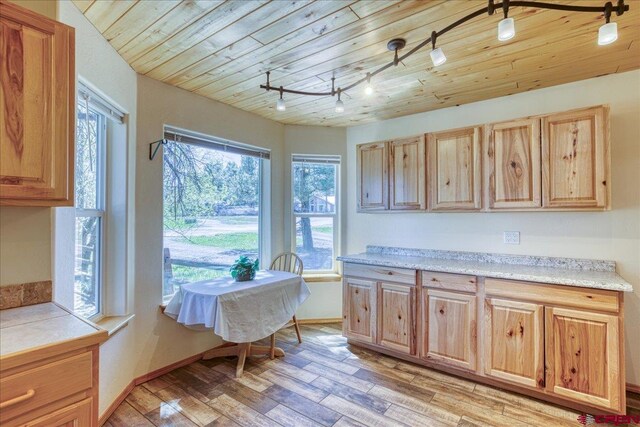 26 Steamboat Dr, Pagosa Springs, CO 81147 - kitchen with track lighting, light brown cabinetry, light countertops, wood ceiling, and light wood-style flooring