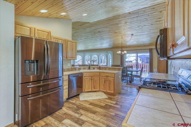 26 Steamboat Dr, Pagosa Springs, CO 81147 - kitchen featuring wooden ceiling, a peninsula, a chandelier, stainless steel appliances, and light wood-style flooring