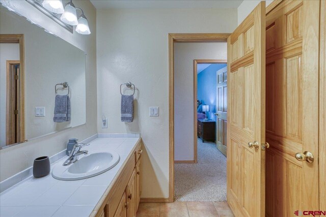 26 Steamboat Dr, Pagosa Springs, CO 81147 - bathroom with vanity, baseboards, and tile patterned floors