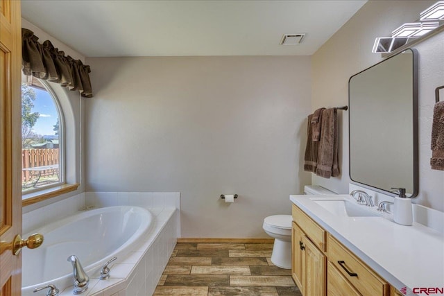 26 Steamboat Dr, Pagosa Springs, CO 81147 - full bathroom featuring vanity, visible vents, wood finished floors, toilet, and a bath