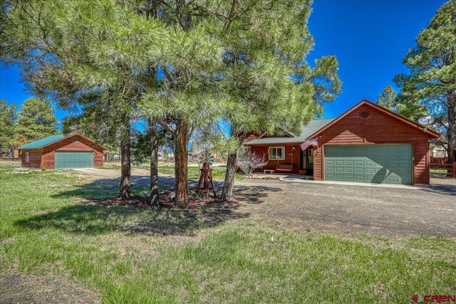 26 Steamboat Dr, Pagosa Springs, CO 81147 - log cabin featuring an attached garage and a front yard