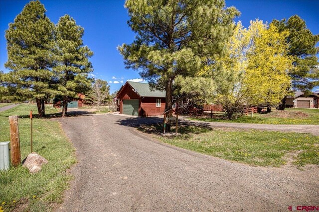 26 Steamboat Dr, Pagosa Springs, CO 81147 - view of front facade featuring a front lawn and a garage