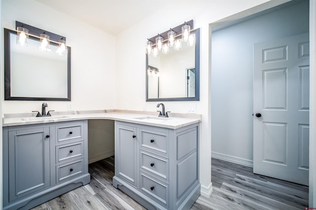 1215 Beaver Creek Dr, Bayfield, CO 81122 - full bath with double vanity, a sink, baseboards, and wood finished floors