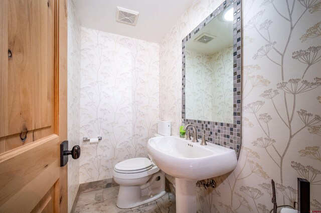 1215 Beaver Creek Dr, Bayfield, CO 81122 - half bathroom with toilet, wallpapered walls, and visible vents