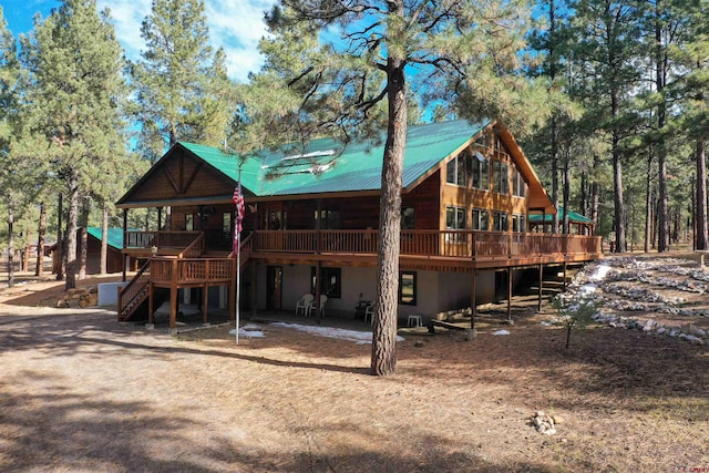 1215 Beaver Creek Dr, Bayfield, CO 81122 - back of house with a deck, metal roof, and stairs