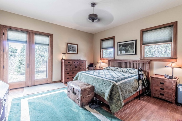 35900 Rd J.8, Mancos, CO 81328 - bedroom with access to outside, multiple windows, hardwood / wood-style flooring, and a ceiling fan