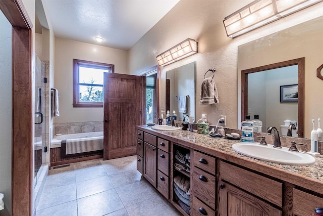 35900 Rd J.8, Mancos, CO 81328 - full bath featuring a garden tub, double vanity, tile patterned floors, a shower stall, and a textured wall