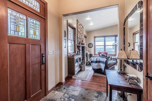 35900 Rd J.8, Mancos, CO 81328 - foyer with lofted ceiling, baseboards, and stone finish flooring