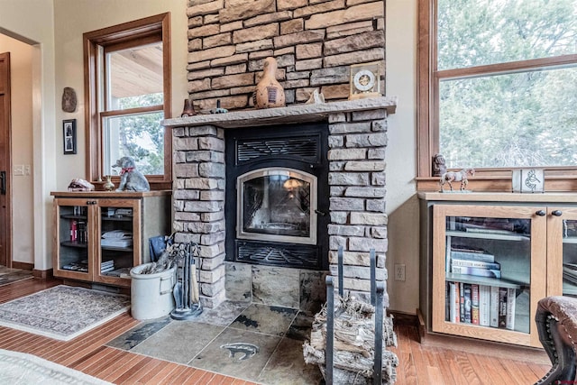 35900 Rd J.8, Mancos, CO 81328 - detailed view of a stone fireplace, wood finished floors, and baseboards