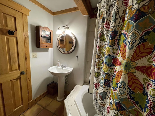 bathroom featuring tile patterned flooring and a sink