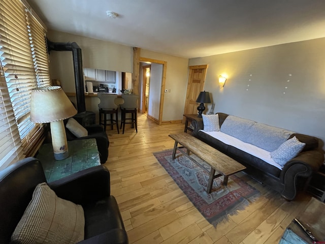 living area with a healthy amount of sunlight and light wood-style flooring