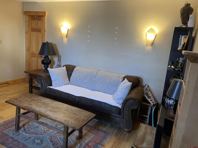 living room featuring baseboards and wood finished floors