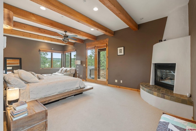 bedroom with access to outside, a fireplace, carpet floors, baseboards, and beamed ceiling