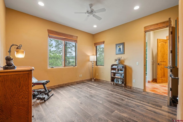 home office featuring baseboards, ceiling fan, recessed lighting, and wood finished floors