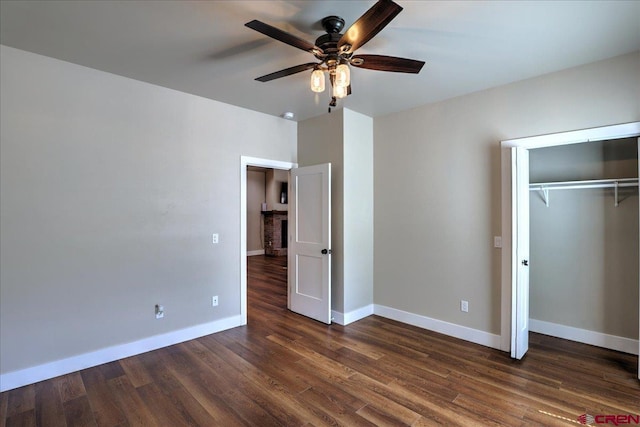 474 Lakewood St, Pagosa Springs, CO 81147 - unfurnished bedroom with baseboards, ceiling fan, a closet, and dark wood finished floors