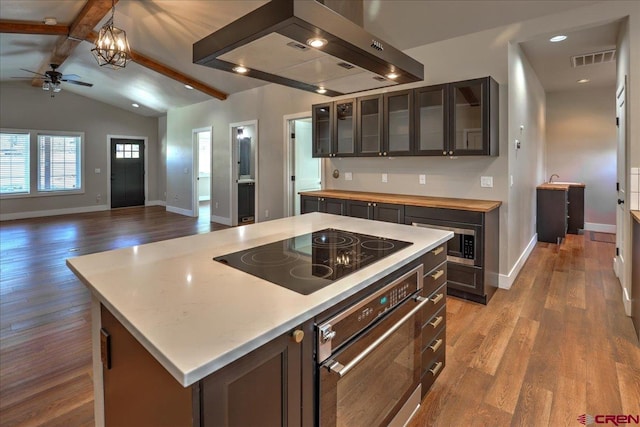 474 Lakewood St, Pagosa Springs, CO 81147 - kitchen with visible vents, appliances with stainless steel finishes, baseboards, extractor fan, and light wood-style flooring
