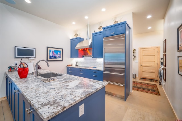 1000 Mushroom Ln, Vallecito Lake/Bayfield, CO 81122 - kitchen featuring independent washer and dryer, blue cabinetry, built in fridge, and a sink