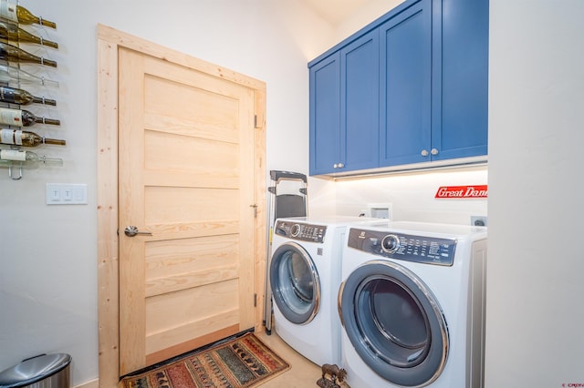 laundry area featuring independent washer and dryer and cabinet space