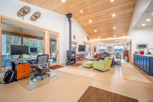 office space with recessed lighting, high vaulted ceiling, wood ceiling, and finished concrete floors