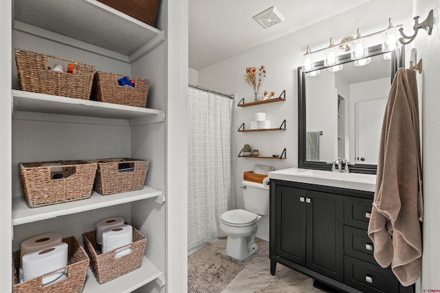 826 E Tamarack Dr, Bayfield, CO 81122 - full bath featuring visible vents, vanity, marble finish floor, toilet, and a shower with shower curtain