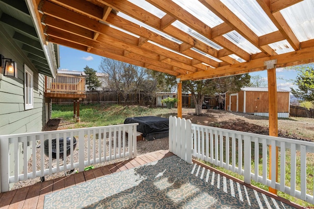 826 E Tamarack Dr, Bayfield, CO 81122 - exterior space featuring a fenced backyard, a shed, an outbuilding, and a deck