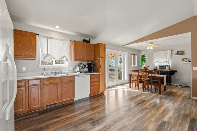 826 E Tamarack Dr, Bayfield, CO 81122 - kitchen featuring white dishwasher, a sink, light countertops, brown cabinetry, and visible vents