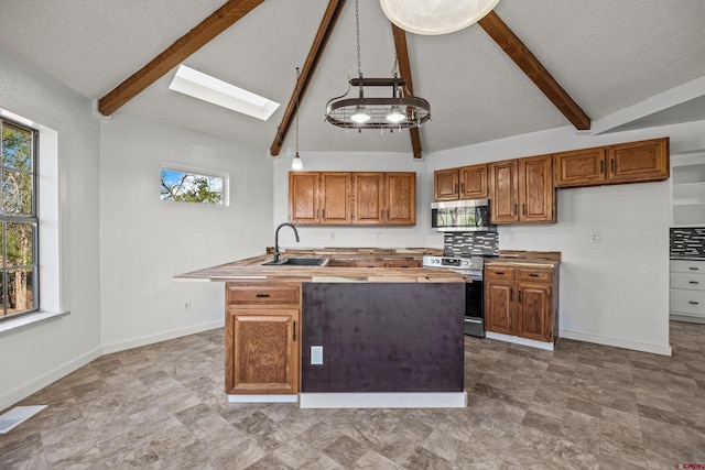 319 Rosevale Rd, Grand Junction, CO 81507 - kitchen featuring butcher block countertops, a skylight, appliances with stainless steel finishes, and beam ceiling