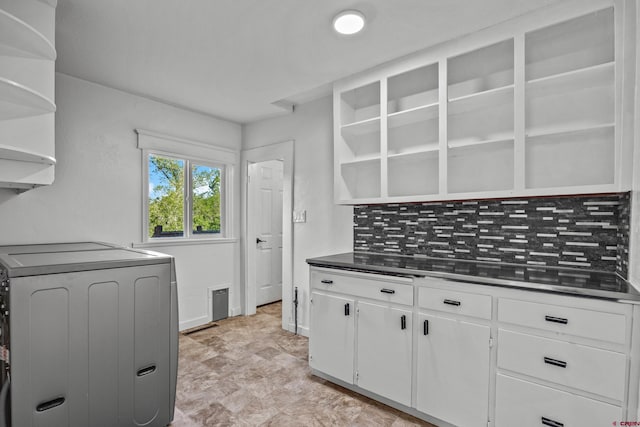 319 Rosevale Rd, Grand Junction, CO 81507 - kitchen featuring white cabinets, open shelves, washer / dryer, and tasteful backsplash