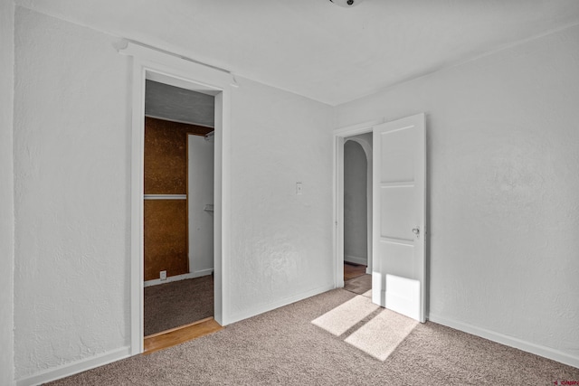 319 Rosevale Rd, Grand Junction, CO 81507 - unfurnished bedroom with carpet flooring, a textured wall, and baseboards