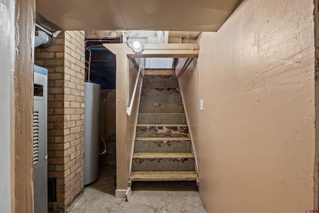 319 Rosevale Rd, Grand Junction, CO 81507 - stairs featuring concrete flooring and water heater