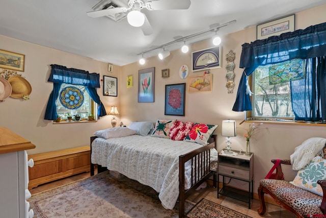 bedroom featuring a ceiling fan and rail lighting