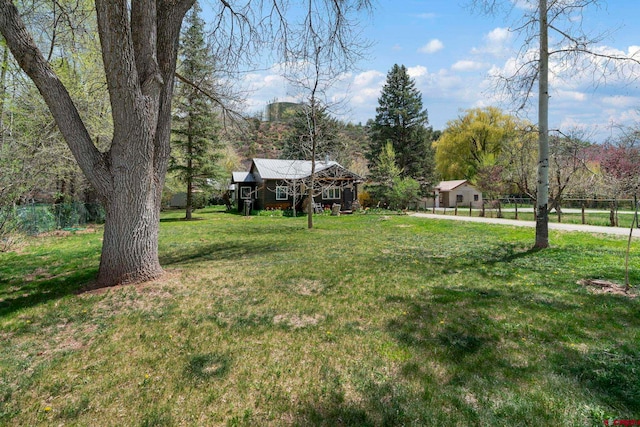 view of yard with fence