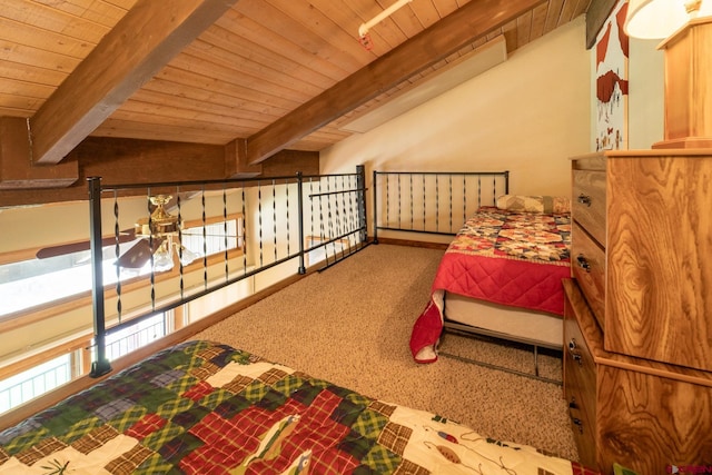 bedroom featuring carpet flooring, wood ceiling, and beam ceiling
