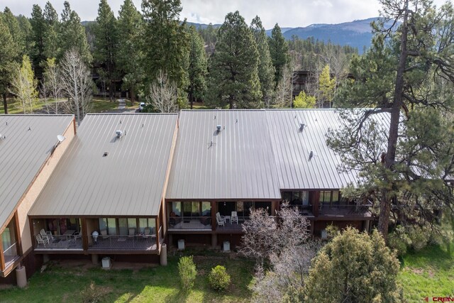 drone / aerial view with a view of trees and a mountain view