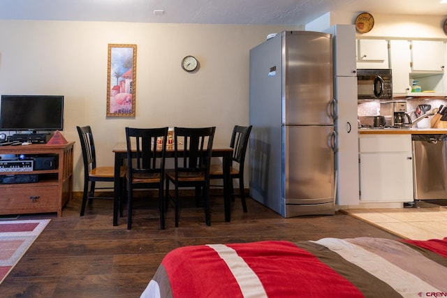dining room with wood finished floors