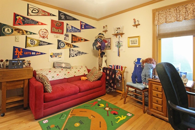 playroom with ornamental molding and wood finished floors