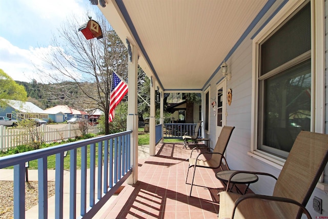 balcony featuring a porch