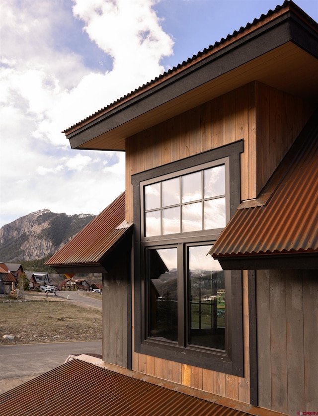 view of side of home featuring a mountain view