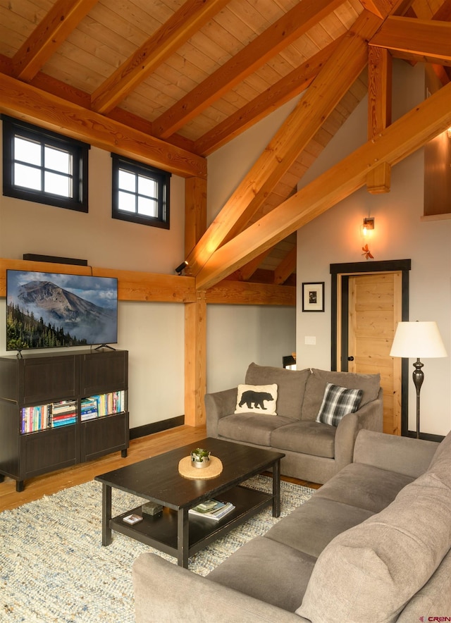 living room with wood ceiling, high vaulted ceiling, beam ceiling, and wood finished floors
