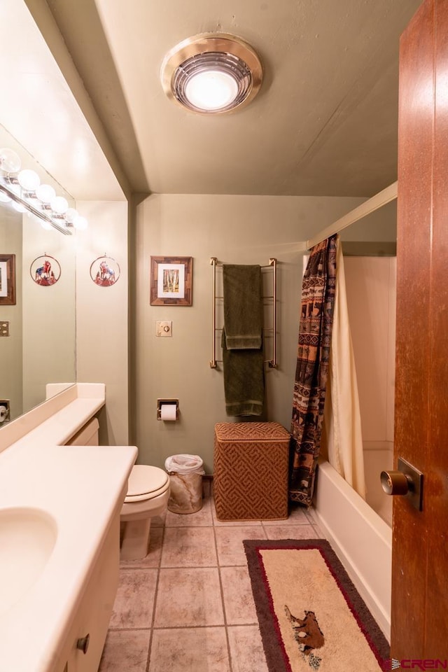 314 N Tamarron Dr Unit 215, Durango, CO 81301 - bathroom featuring tile patterned flooring, shower / bath combo, toilet, and vanity