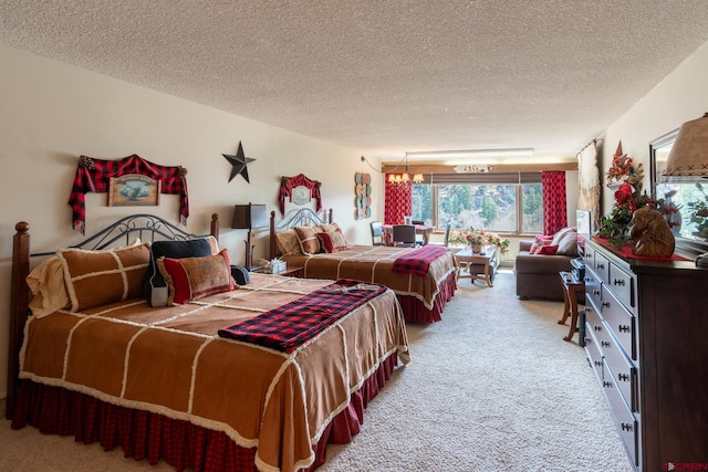 carpeted bedroom with a textured ceiling and a chandelier